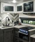 Heavy Duty RV Kitchen Faucet Built Tight For Campers And Vans Smooth Turning 360 Head in a modern RV kitchen.