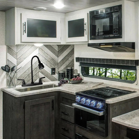 Heavy Duty RV Kitchen Faucet Built Tight For Campers And Vans Smooth Turning 360 Head in a modern RV kitchen.
