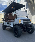 White 6 Passenger 4+2 Seater Electric Golf Cart With 48V 150Ah Lithium Battery And One Click Start parked on urban road.