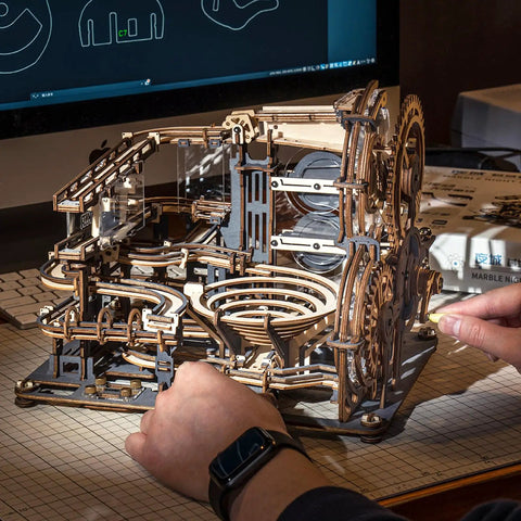 Person assembling 3D Wooden Marble Run Puzzle Kit For Adults with 294 Pieces, featuring mechanical gears in Night City theme.
