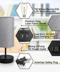 Dual USB Charging Ports And AC Outlet Nightstand Lamps Set Of 2 with grey fabric shades, Edison LED bulbs, USB ports, and safety plug.