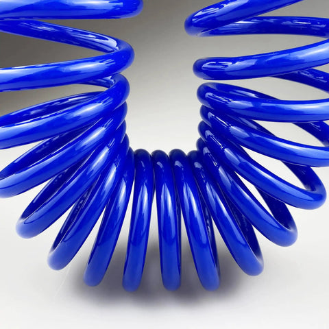 Close-up of a coiled blue Flexible Polyurethane Recoil Air Hose, One Quarter Inch Inner Diameter, Ten Feet With Bend Restrictor