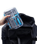 Ultra Handy 68 Piece Ratcheting Screwdriver Set With Magnetic Bits And Sockets In A Tough Impact Case shown being placed in a backpack