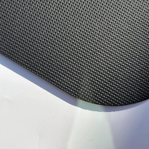 Close-up of textured surface of a Non Slip Recliner Floor Protectors For Hardwood Floors With Anti Slip Grippers Keeps Chairs From Sliding And Scratching.