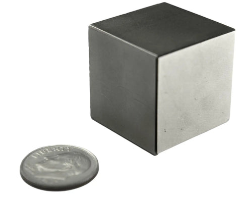 Heavy Duty 1 Inch Neodymium Magnet Cube For Engineering And Fabrication, Testing And Industrial Holding Tasks NdFeB Rare Earth Block With 150 Lb Pull Force next to a coin for size comparison.