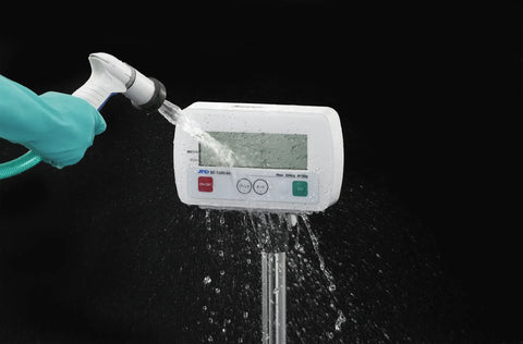 Built Tough Heavy Duty Digital Platform Scale With Zero Hassle Washdown Protection And Rock Solid 330 Pounds Capacity Including Fast Stabilization And Extended Battery Life being rinsed with water.