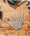 Houdereco Heavy Duty Multi Purpose Tubing Bender Set Includes Seven Versatile Spring Bending Tools For Thin Walled Pipes Plumbing And Electrical Work Durable No Deformation Exhaust And Brake Line Kit, seven steel spring tools on a wooden surface.
