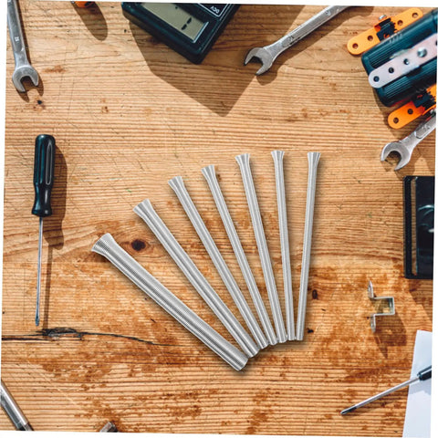 Houdereco Heavy Duty Multi Purpose Tubing Bender Set Includes Seven Versatile Spring Bending Tools For Thin Walled Pipes Plumbing And Electrical Work Durable No Deformation Exhaust And Brake Line Kit, seven steel spring tools on a wooden surface.