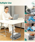 Woman using Under Desk Heated Foot Rest With Adjustable Height And Dual Heat Levels for office use and relaxation