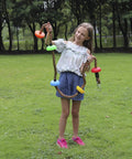 Girl holding Colorful Climbing Rope Six Point Five Feet With Five Knotted Foot Holds For Kids Ninja Warrior Setup Slackline Obstacle Course