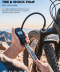 Using the 320 PSI High Pressure Bike Shock Pump With Gauge For Front Fork And Rear Suspension Aluminum Portable Frame Pump outdoors