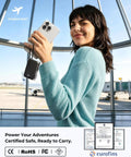 Hella Slick Compact Portable Charger 10000mAh Power Bank With Built In Usb C And Usb A Cables Plus AC Plug For Grab And Go Travel Everyday Carry Setup Gear held by smiling woman in sweater.