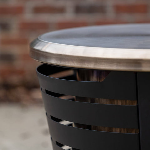 Closeup of gold 25.6 inch Tabletop Fire Pit Cover For Patio Pits 25.6 Inch Durable Stainless Steel Lid Weather Resistant Outdoor Fire Pit Protector Converts Fire Pit Into A Table For Chill Entertaining Gold on fire pit.