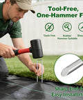 Person installing Heavy Duty Galvanized Landscape Staples 6 Inch 500 Pack U Shaped Sod Pins with mallet on black weed barrier.