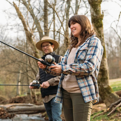 Two people fishing with Grab And Go Spincast Rod And Reel Combo With A Six Foot Two Piece Fiberglass Rod And Size 30 Reel