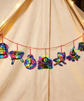 Camping Scratch Card Kit 24 Pack For Outdoor Parties 12 Unique Designs Revealing Rainbow Colors hanging on a red string