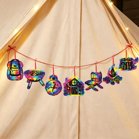 Camping Scratch Card Kit 24 Pack For Outdoor Parties 12 Unique Designs Revealing Rainbow Colors hanging on a red string