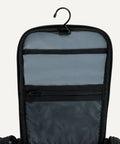 Spacious Hanging Toiletry Bag With Durable 1680D Polyester Large Capacity Dopp Kit Multiple Compartments Leakproof Lining Must Have Travel Organizer Black showing open top with hook and mesh pocket