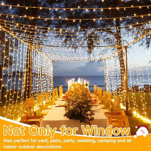 Christmas Curtain Lights 300 LED 9.8 By 9.8 Feet Waterproof Outdoor Curtain String Lights decorate a beachside dinner setup.