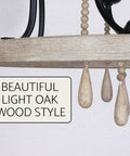 Detail view of Three-Light Farmhouse Pendant Chandelier With Hanging Wood Accents In Light Oak And Black Finish 23-Inch