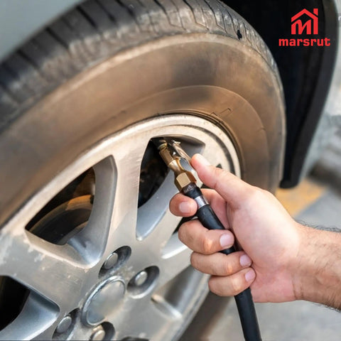 No Sweat Quarter Inch Tire Inflator Extension Hose With Fast Grip Self Locking Chuck inflating a car tire at a gas station.