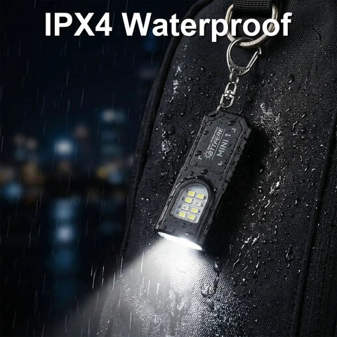 Three Pack Bright Rechargeable Keychain Flashlights With Clip And Magnetic Base Mini LED Key Ring Light in rain shown attached to bag