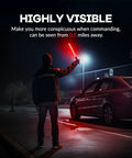 Person using 10 Pack 21 Inch Lit LED Traffic Safety Wand With 3 Flashing Modes For Parking Guides And Air Traffic Style Signals Lightweight PVC Baton That Runs On 2 C Batteries Not Included in a dark parking lot for high visibility.