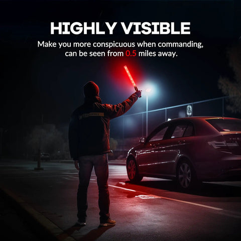 Person using 10 Pack 21 Inch Lit LED Traffic Safety Wand With 3 Flashing Modes For Parking Guides And Air Traffic Style Signals Lightweight PVC Baton That Runs On 2 C Batteries Not Included in a dark parking lot for high visibility.