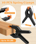 Heavy Duty 4.5 Inch Plastic Spring Clamps Set of 10 Backdrop Clips for Balloon Arches, Photography, Woodworking, Crafts, Tarp, Studio or Outdoor Use, Tough Grip Black Clips holding wood
