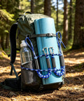 Backpack on forest trail with blue mat and water bottle, secured using Elastic Bungee Dock Line For Boats, 4 Ft Mooring Rope.