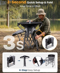 Person folding an Oversized Camping Directors Chair With Side Table, Heavy Duty 440 Lb Load, in a forest setting.
