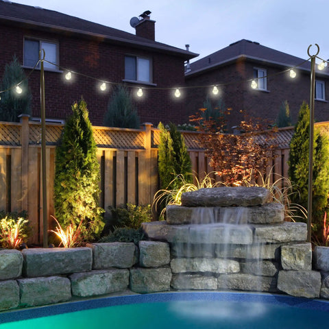 2 Pack 10Ft Spiral Screw In Outdoor String Light Poles For Patio And Garden No Fuss Install around backyard poolside at dusk.