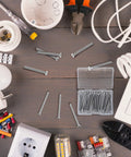30 Pack Extra Long Electrical Outlet Screws In Mixed Sizes 1.5 Inches on table with tools and electrical parts for installation.