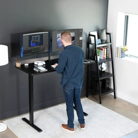 Person using Electric Standing Desk With Memory Height Adjustment, 60 X 24 Inch One Piece Black Top, Holds Up To 220 Lbs