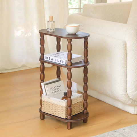 Three Tier Narrow Side Table With Storage For Small Spaces beside a couch with books and a tea cup in rustic brown