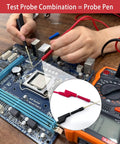 Hands using 30 Piece Silicone Banana Plug Test Leads Kit With 4mm Stackable Banana Plugs on a computer motherboard