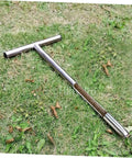 304 Stainless Steel Soil Sampler Tool With T Handle for lawn and garden testing laying on grass