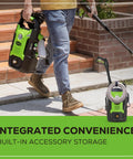 Person carrying Compact Electric Pressure Washer 1600 PSI 1.2 GPM, Lightweight CSA Certified, near staircase.