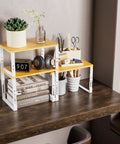 Stackable Adjustable Storage Shelves For Kitchen Cabinets Set Of Two Made Of Metal And Solid Wood on a desk with decor items