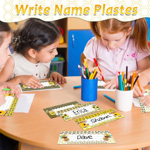 Kids using Flat Name Plates With Alphabet And Numbers 72 Pack Self Adhesive Name Tags For Classrooms Arts And Crafts on a table