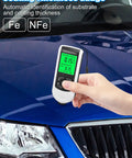 Pro Grade Auto Paint Coating Thickness Gauge With Ultra High Probe For Spot-On Car Paint Measurements 0 To 2000 Micrometers, Dual Principle Sensor, Easy Readout, Field Ready Finish Inspection Tool on blue car hood