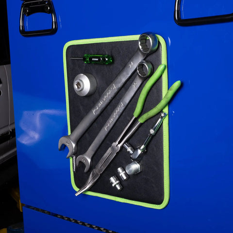 Magnetic Tool Pad 12.5 x 9.75 Inch Flexible Magnet Tray in green and black holding tools on blue ferrous surface.