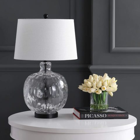 Clear Glass And Black Metal LED Table Lamp For Bedroom And Living Room on white table beside tulips and books