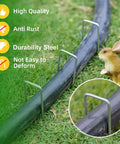 Tough As Nails Heavy Duty Galvanized 5 Inch Lawn Staples 11 Gauge U Shaped Ground Spikes securing a hose on grass.