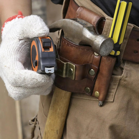 Leather Tool Holster With Hammer Loop, Tape Measure Holder, And Pencil Pouch For Belt in use on jobsite