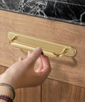 Hand installing 2 Pack Champagne Bronze Cabinet Pulls With Backplates, 7 1/2 Inch Center-to-Center Drawer Handles on wooden cabinet