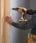 Person using 20V Max XR Cordless Drywall Screw Gun With LED Light 4400 RPM Beast Brushless Motor Bare Tool Only Quick Nosecone Release for drywall fastening