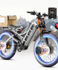 Badass Dual Motor Electric Mountain Bike Featuring Heavy Duty 60V 80Ah Battery And 5600W Kickass Power With 26 Inch Fat Tires showing a sleek design and delivery box.