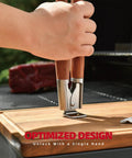 Hand holding rosewood BBQ tongs from Heavy Duty Rosewood BBQ Tools Set With Extra Thick Stainless Steel Spatula Fork And Tongs For Grilling Mastery Great Gift For Dad And Grill Crew Durable Indoor Outdoor Utensils For Barbecue on wooden cutting board.