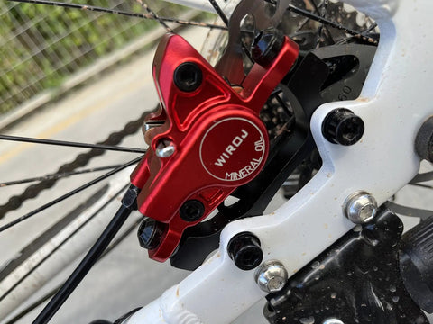 Sick Stopping Power Hydraulic Disc Brake Set For Mountain Bikes includes red caliper with mineral oil labeling and black rotor.